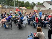 Adults and children waiting for the show to start