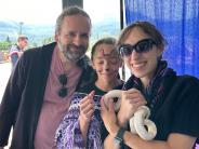 City Councilor Jimmy Murray and family admiring a snake 