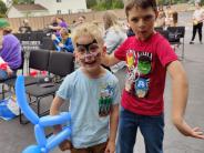 Two boys with balloons and facepaint